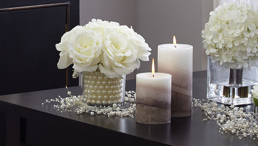 Add coordinating or matching candles in various heights for a soft glow